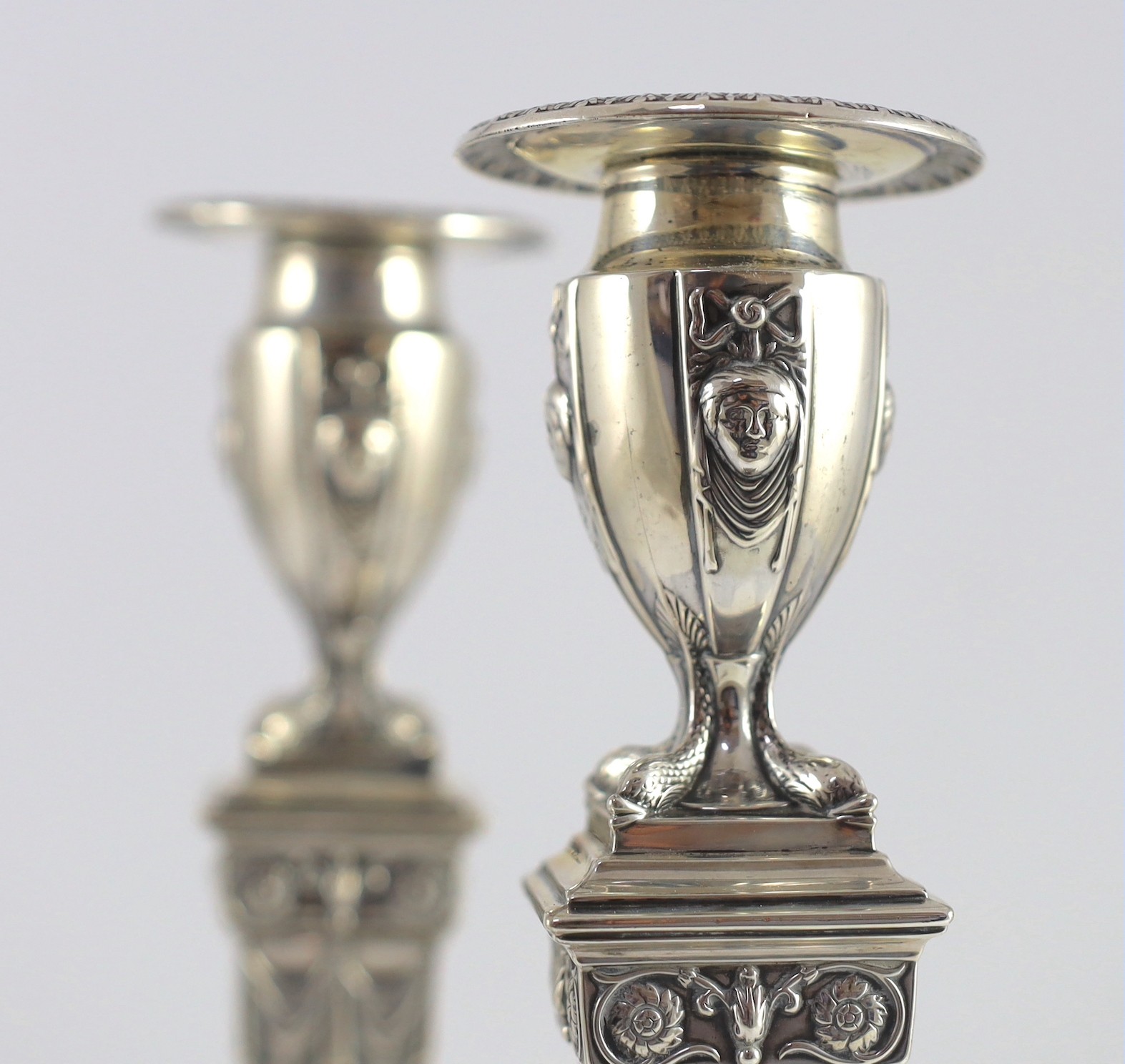 An ornate pair of late Victorian silver candlesticks by Mappin Bros.